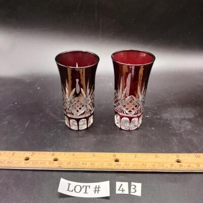 43 - pair vintage ruby to clear cut glass shooters