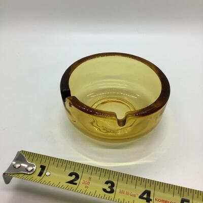 Yellow tint glass ashtray