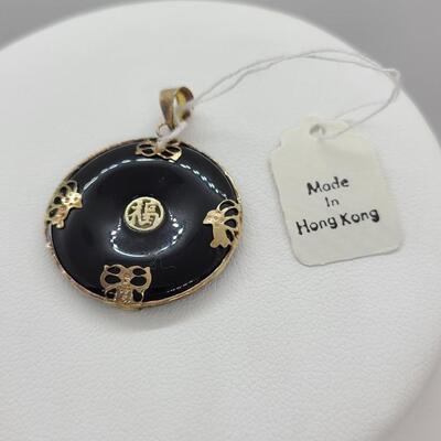 LOTJ: 14kt Yellow Gold and Onyx Pendant