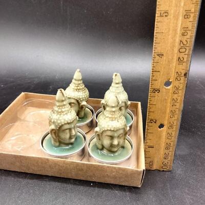 84 - 4 buddha head tealite candles