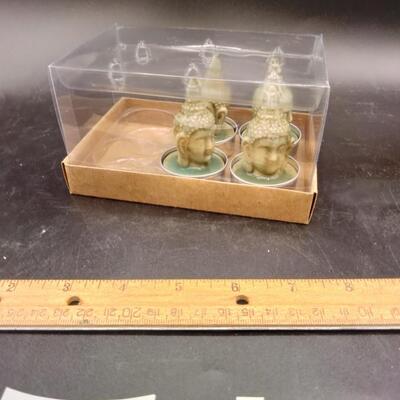 84 - 4 buddha head tealite candles