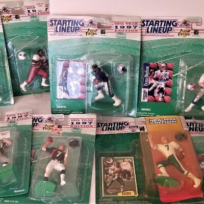 Lot #94  Large Lot of 1997 "Starting Lineup" football player action figures - all new on card