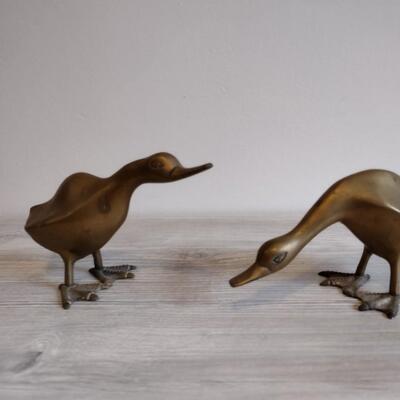 Two brass ducks