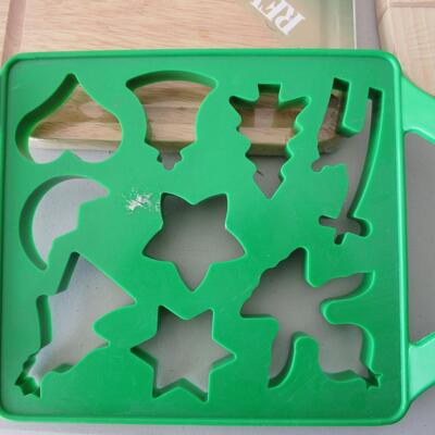 #18 2 New cutting boards, two 12 cup cupcake pans, cookie cutter