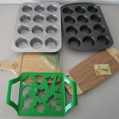 #18 2 New cutting boards, two 12 cup cupcake pans, cookie cutter
