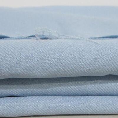 #33 3 1/4 yards of light blue polyester material