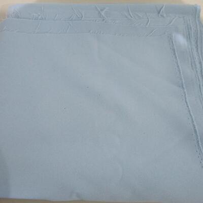 #33 3 1/4 yards of light blue polyester material