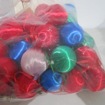 #35 Christmas tree ornaments and one large floral pic