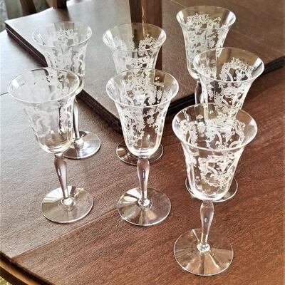 Lot #129  Set of 7 Etched Crystal Wine Glasses - pretty!