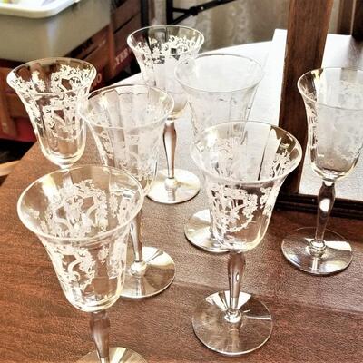 Lot #129  Set of 7 Etched Crystal Wine Glasses - pretty!