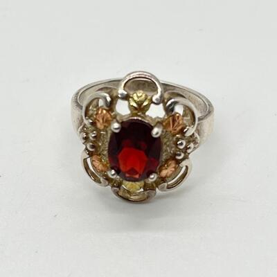 LOT 56: Sterling Silver and 12K Tri-Color Gold and Garnet Ring - TW 4.9g  Size 8