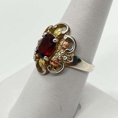 LOT 56: Sterling Silver and 12K Tri-Color Gold and Garnet Ring - TW 4.9g  Size 8