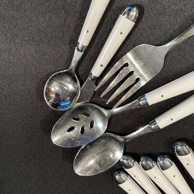 Partial Set of White Plastic Handled Silver ware