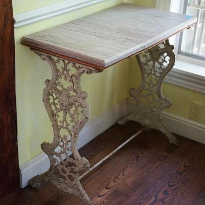 ANTIQUE CAST METAL BASE TABLE ORNATE WITH CHERUB FACE ACCENT