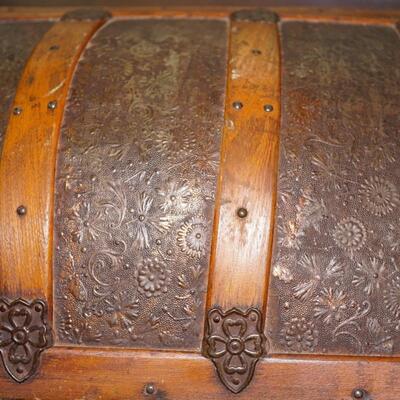 LATE 19TH CENTURY DOME TOP TRUNK W/PRESSED TIN FLORAL PATTERN AND OAK STRAPPING.