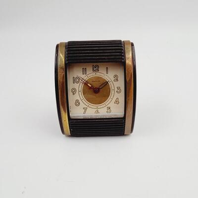 VINTAGE MC WESTCLOX BROWN ROLL TOP TRAVEL ALARM CLOCK