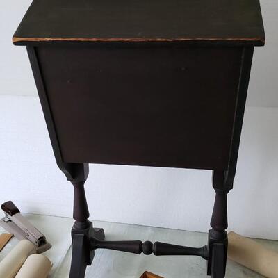 Antique sewing box with buttons, scissors and wooden spools