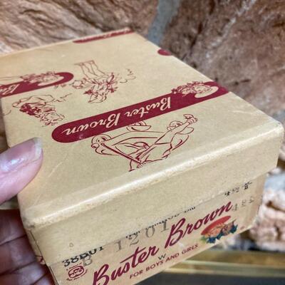 Vintage buster brown shoebox with baby shoes