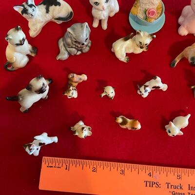 Several cat figurines