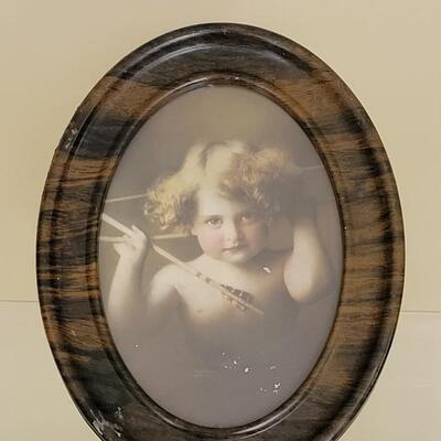 Lot 67: Antique Cupid Print in A Metal Frame