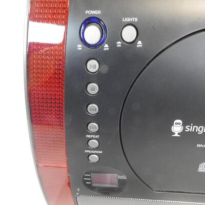 "Singing Machine" CD player with lights & speakers. Has inputs for microphones
