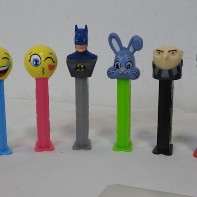 16 PEZ Dispensers. 8 Disney & 8 Others: Batman, Buzz Lightyear, Mickey Mouse