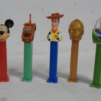 16 PEZ Dispensers. 8 Disney & 8 Others: Batman, Buzz Lightyear, Mickey Mouse