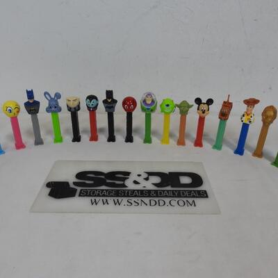 16 PEZ Dispensers. 8 Disney & 8 Others: Batman, Buzz Lightyear, Mickey Mouse