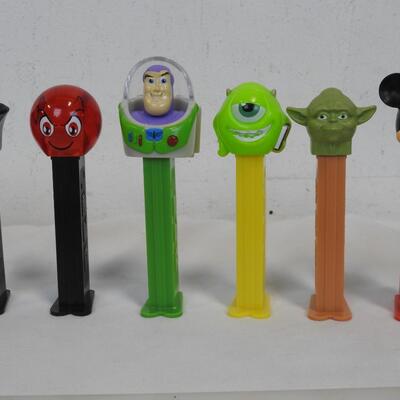 16 PEZ Dispensers. 8 Disney & 8 Others: Batman, Buzz Lightyear, Mickey Mouse
