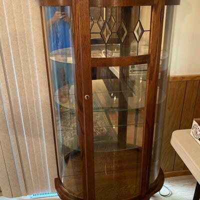 K1 china Hutch, 65 inches in height, 31 inches wide, 13 inches deep, curved glass. Feet need repairing. One or two of them are loose.