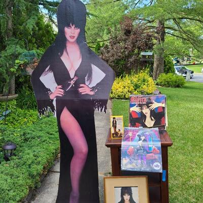 Lot 201: Vintage Elvira Cut-Out, Calendars, Prints, VHS. And More