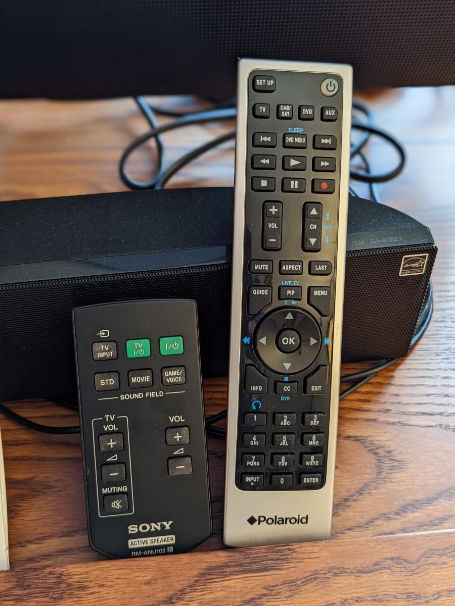 Quality Polaroid TV, Sony Sound Bar, and Entertainment Center
