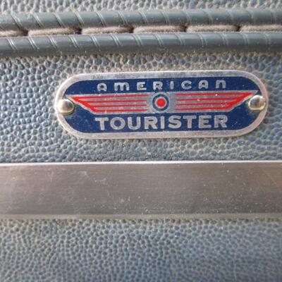 #44 American Tourister blue suitcase