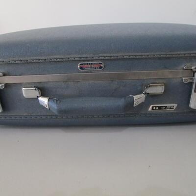 #44 American Tourister blue suitcase