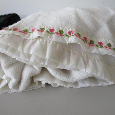 #61 Homemade Afghan and White Blanket with embroidered flowers at the top