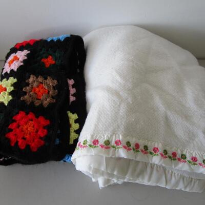 #61 Homemade Afghan and White Blanket with embroidered flowers at the top