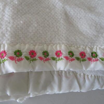 #61 Homemade Afghan and White Blanket with embroidered flowers at the top