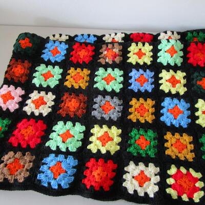 #61 Homemade Afghan and White Blanket with embroidered flowers at the top