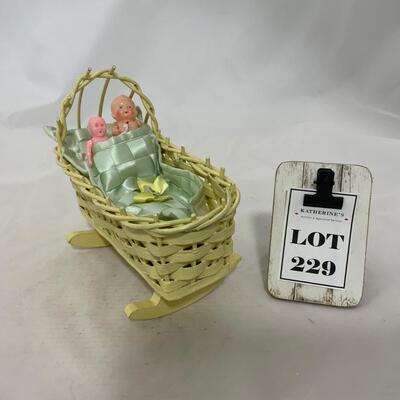 .229. Mini Wicker Doll Cradle | Celluloid Doll
