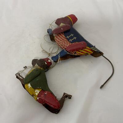 .234. Two Tin Climbing Monkeys