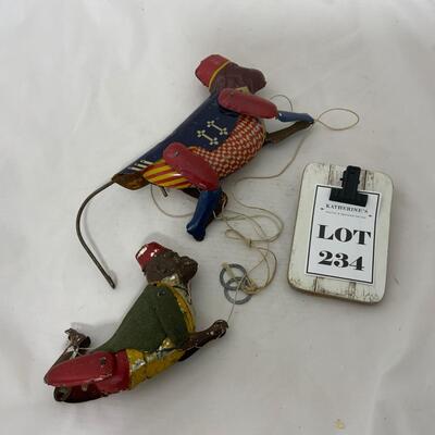 .234. Two Tin Climbing Monkeys