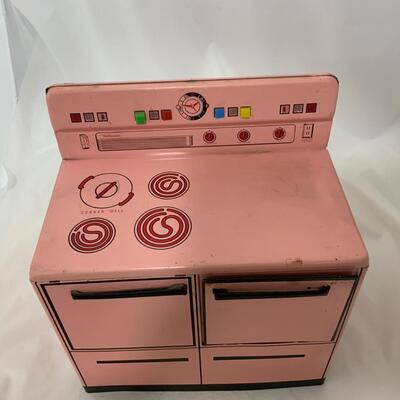 .238. Pink Wolverine Metal Stove | c. 1950
