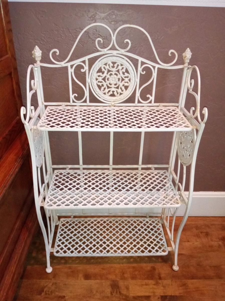 LOT 84 IRON FOLDING SHELF WITH PICTURE FRAMES | EstateSales.org