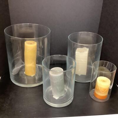 Lot 1097. Set of Four Clear Glass Hurricane Globes ( with candles )