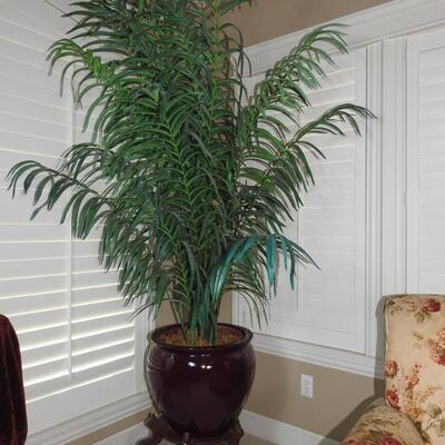 Potted artificial palm with cast iron stand