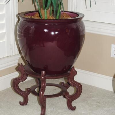 Potted artificial palm with cast iron stand