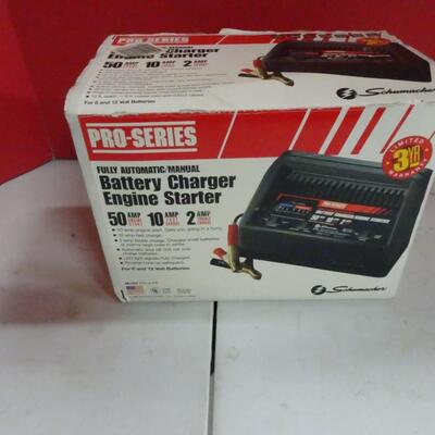LOT 199        PRO SERIES BATTERY CHARGER AND ENGINE STARTER