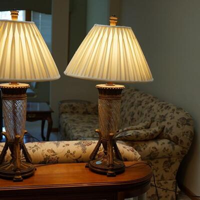 PAIR OF DALE TIFFANY TABLE LAMPS. TEXTURED SWIRL  GLASS CENTERS AND BRONZE ROMANESQUE BRONZE BASE