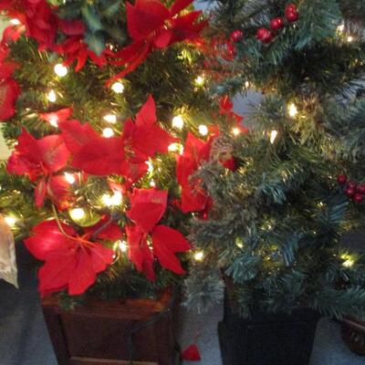 Two 4 ft faux Christmas trees