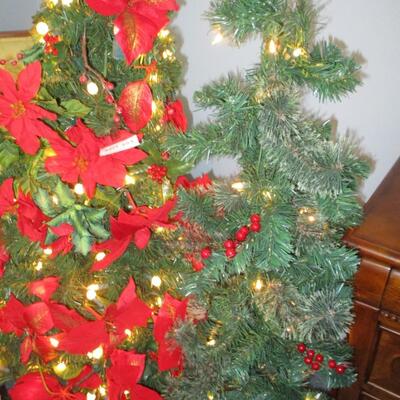 Two 4 ft faux Christmas trees